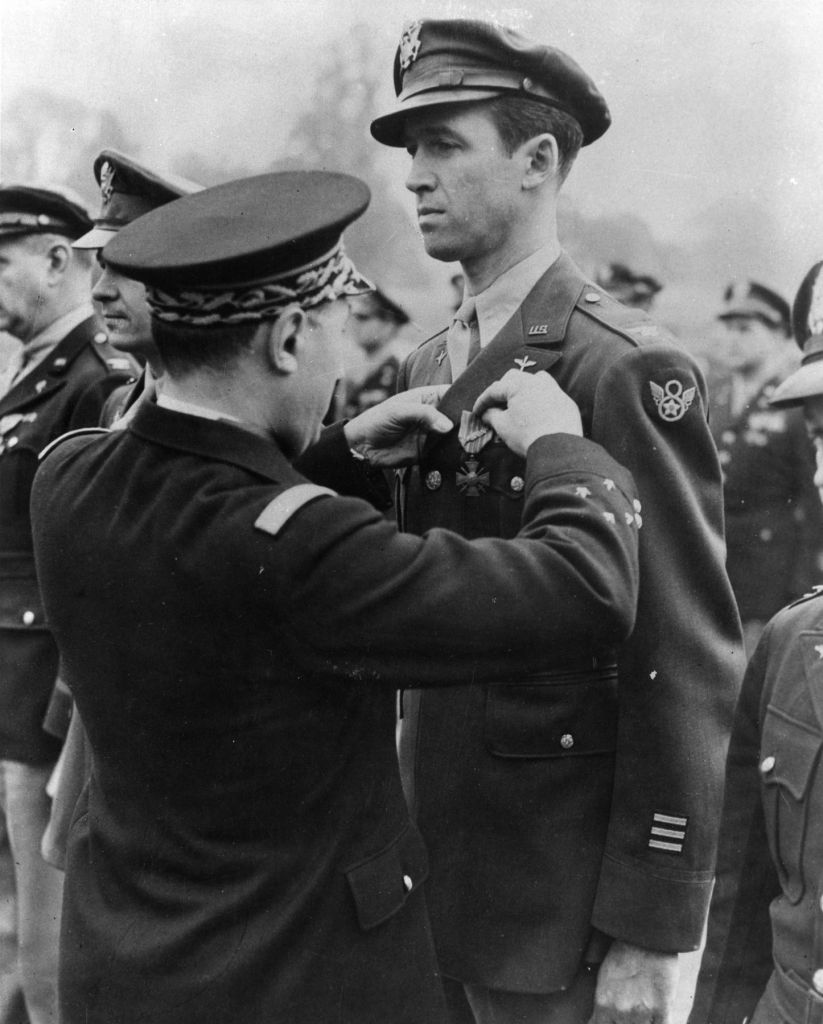 Lt. Gen. Valin, Chief of Staff, French Air Force, awards the Croix De Guerre with Palm to Col. Jimmy Stewart for exceptional services in the liberation.